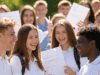 A-Level Results 2025: Top Grades Surge with Record University Acceptances Alt Text: Excited students in Solihull celebrating their 2025 A-level results with top grades, surrounded by university acceptance letters.