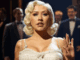 Christina Aguilera Burlesque Legacy News: Musical Revival Excites Fans Alt text: Image of Christina Aguilera Burlesque legacy news, with her on stage with the musical cast.