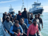 Immigration and Border Security Challenges Under Labour Government in 2025 Alt Text: Small boat migrants crossing the English Channel, with Border Force vessels in the background, highlighting immigration and border security challenges in 2025.