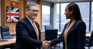 Starmer’s Team Reshuffle Boosts Economic Expertise Ahead Alt Text: Illustration of Keir Starmer with advisors in a modern office setting
