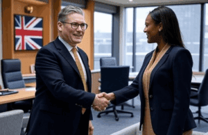 Starmer’s Team Reshuffle Boosts Economic Expertise Ahead Alt Text: Illustration of Keir Starmer with advisors in a modern office setting